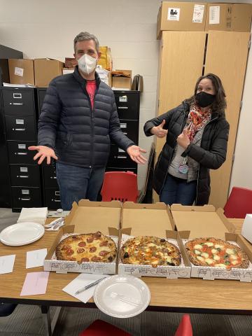 Abingdon's principals posing with pizza purchased for them by the PTA