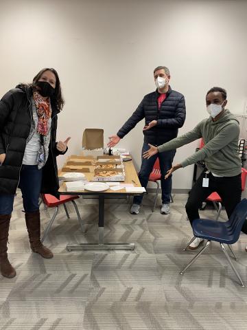 Abingdon's principals posing with pizza purchased for them by the PTA