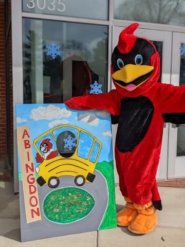 Abingdon Cardinal posing in front of photo prop at Winter Wonderland