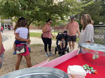 Parents gathering in front of the school for our Tears and Cheers event on the first day of school